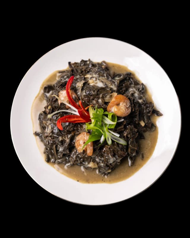 Filipino laing taro leaves in coconut milk served with rice