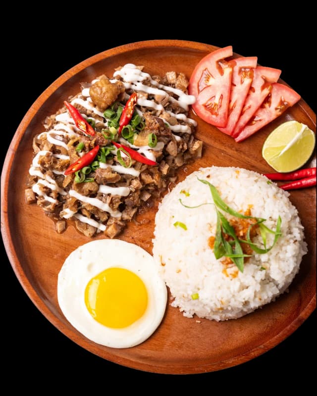 Sizzling bangus milkfish sisig on a hot plate